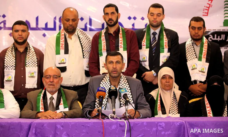 Palestinian members of El-wafa' of Deir al-Balah, an electoral list for the upcoming Gaza municipality polls, hold a press conference in Deir Al Balah in the center of Gaza strip, on Aug. 27, 2016. Photo by Ashraf Amra