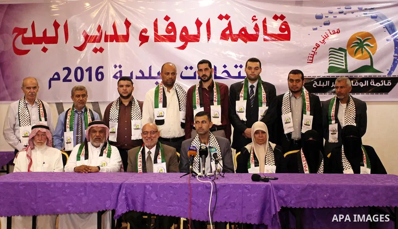 Palestinian members of El-wafa' of Deir al-Balah, an electoral list for the upcoming Gaza municipality polls, hold a press conference in Deir Al Balah in the center of Gaza strip, on Aug. 27, 2016. Photo by Ashraf Amra