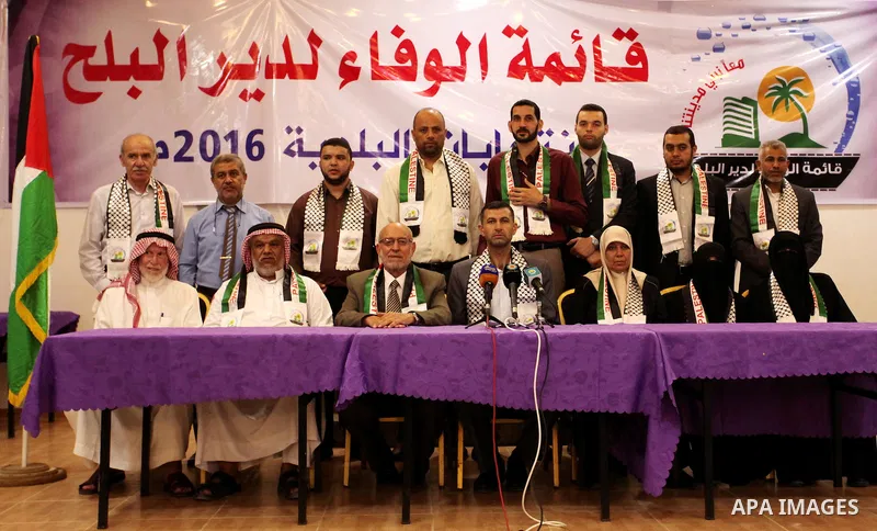Palestinian members of El-wafa' of Deir al-Balah, an electoral list for the upcoming Gaza municipality polls, hold a press conference in Deir Al Balah in the center of Gaza strip, on Aug. 27, 2016. Photo by Ashraf Amra