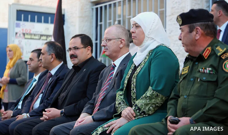 Palestinian Prime Minister Rami Hamdallah visits a school during the first day of the new school year in the West Bank city of Ramallah, on August 28, 2016. Photo by Prime Minister Office