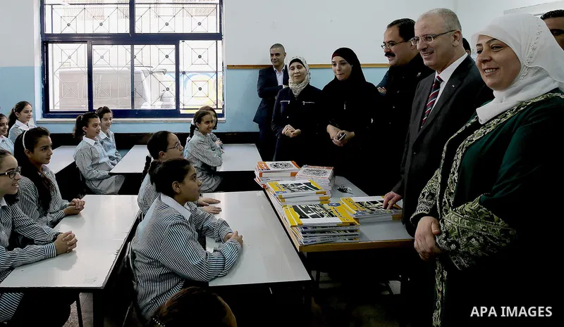 Palestinian Prime Minister Rami Hamdallah visits a school during the first day of the new school year in the West Bank city of Ramallah, on August 28, 2016. Photo by Prime Minister Office