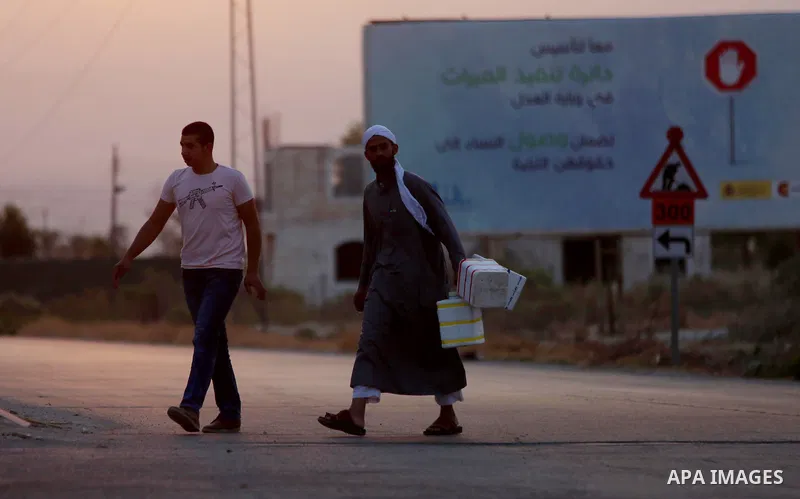 Palestinians Muslim pilgrims wait at Al-Karama crossing between the West Bank and Jordan near Jericho, on August 28, 2016, before leaving for the annual hajj pilgrimage to the holy city of Mecca. Hundreds of Palestinian...