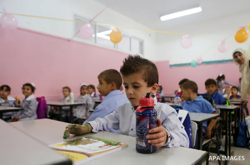 Ahmed Dawabsha, who suffered severe burns in an arson attack by suspected Jewish attackers on his family home last year in which his younger brother, Ali, and his parents both died, attends a lesson in a classroom on the...