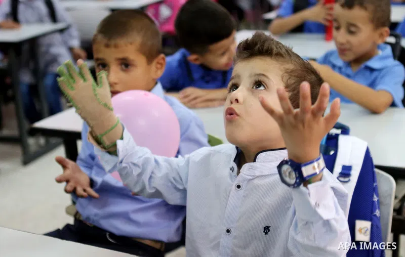 Ahmed Dawabsha, who suffered severe burns in an arson attack by suspected Jewish attackers on his family home last year in which his younger brother, Ali, and his parents both died, attends a lesson in a classroom on the...