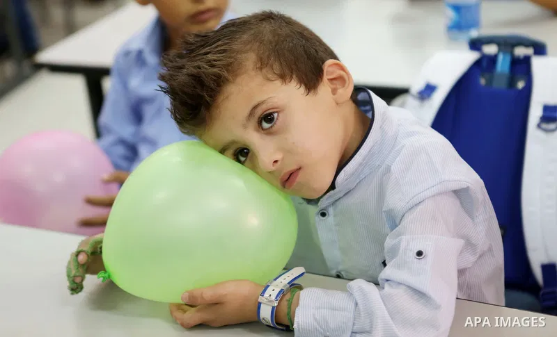 Ahmed Dawabsha, who suffered severe burns in an arson attack by suspected Jewish attackers on his family home last year in which his younger brother, Ali, and his parents both died, attends a lesson in a classroom on the...
