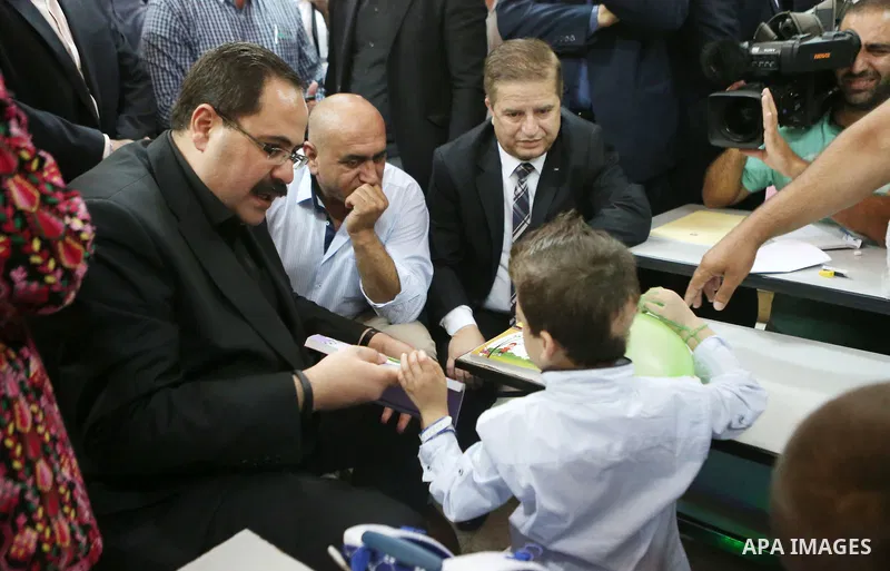 Ahmed Dawabsha, who suffered severe burns in an arson attack by suspected Jewish attackers on his family home last year in which his younger brother, Ali, and his parents both died, attends a lesson in a classroom on the...