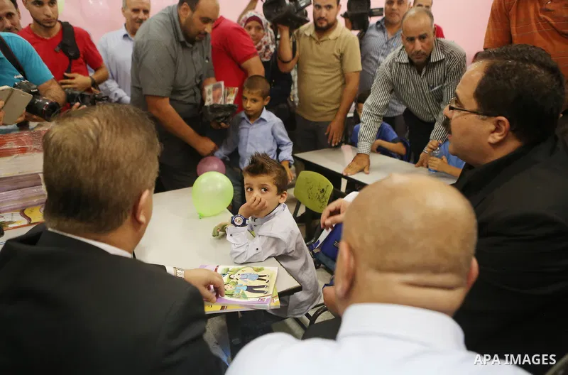 Ahmed Dawabsha, who suffered severe burns in an arson attack by suspected Jewish attackers on his family home last year in which his younger brother, Ali, and his parents both died, attends a lesson in a classroom on the...