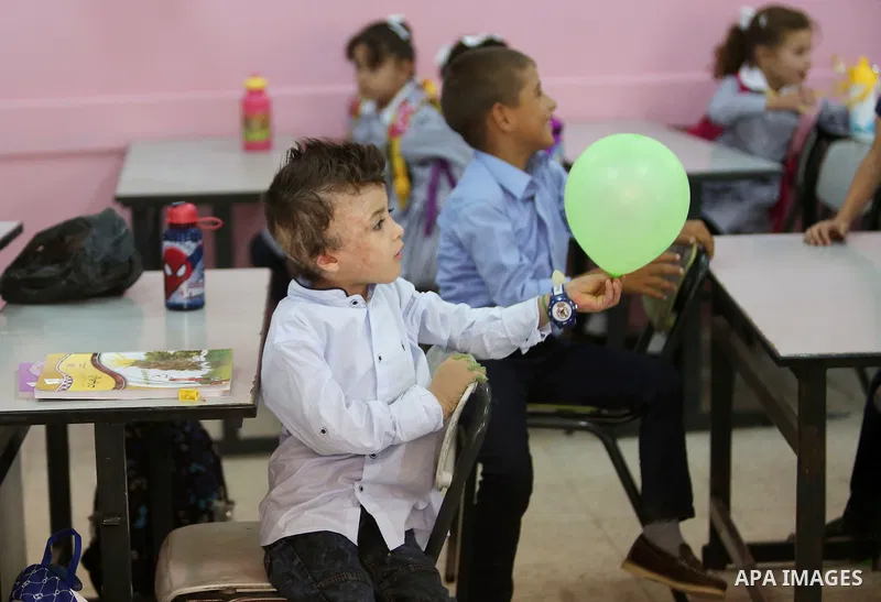 Ahmed Dawabsha, who suffered severe burns in an arson attack by suspected Jewish attackers on his family home last year in which his younger brother, Ali, and his parents both died, attends a lesson in a classroom on the...