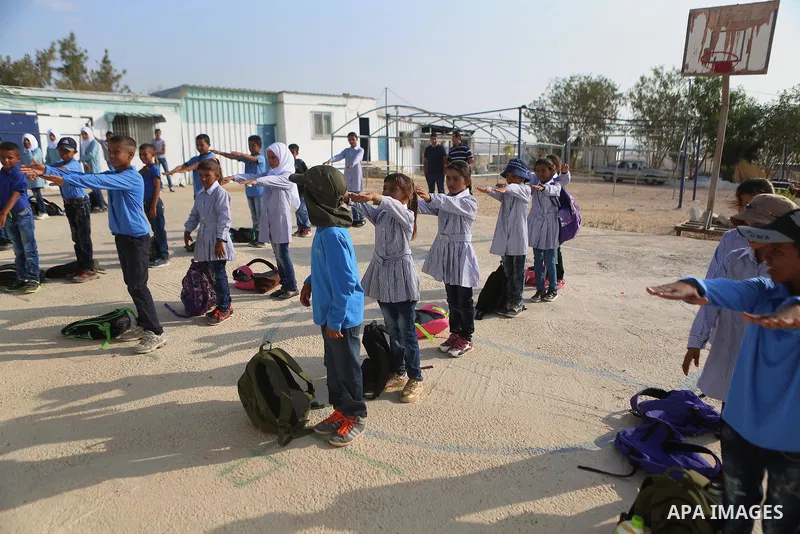 Palestinian Bedouin Students play exercises at Arab Al-Ka'abneh school in Al-Mu'arrajat area near the West Bank city of Jericho, on the first day of a new school year on Aug. 28, 2016. Dozens of Palestinian children in t...
