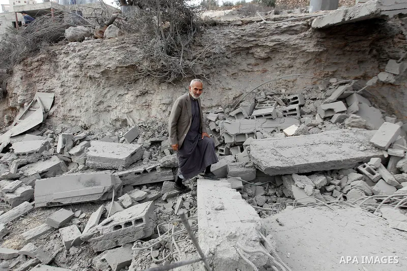 A Palestinian man inspects the rubble of the home of Mohammed Abed Almajid El-Amaira, a Palestinian accused of involvement in a shooting attack that led to the death of a rabbi, after it was destroyed by Israeli military...