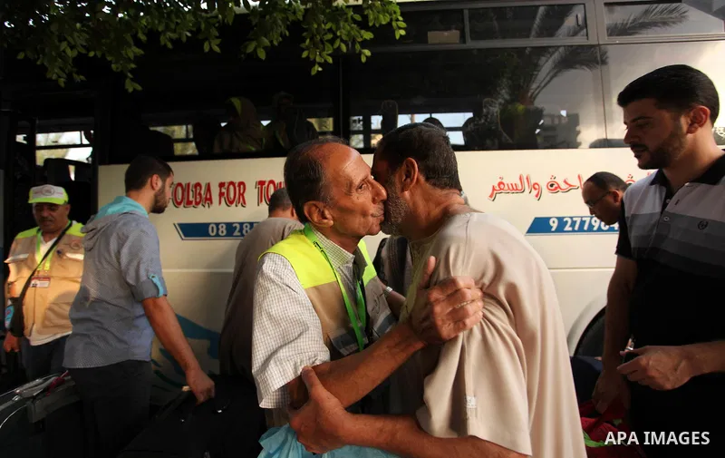 A Palestinian man bids farewell to his brother, who is preparing to leave for the annual Hajj pilgrimage in Mecca, in Gaza City August 30, 2016. Photo by Ashraf Amra