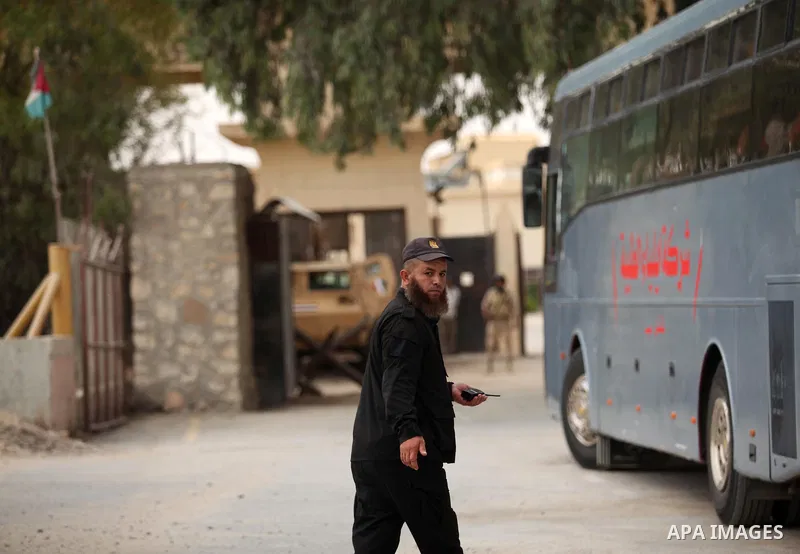 A member of Palestinian security forces loyal to Hamas stands guard as the bus of Palestinian Muslim pilgrims leaving the Rafah border crossing between Egypt and the southern Gaza Strip, on August 30, 2016, ahead of her...