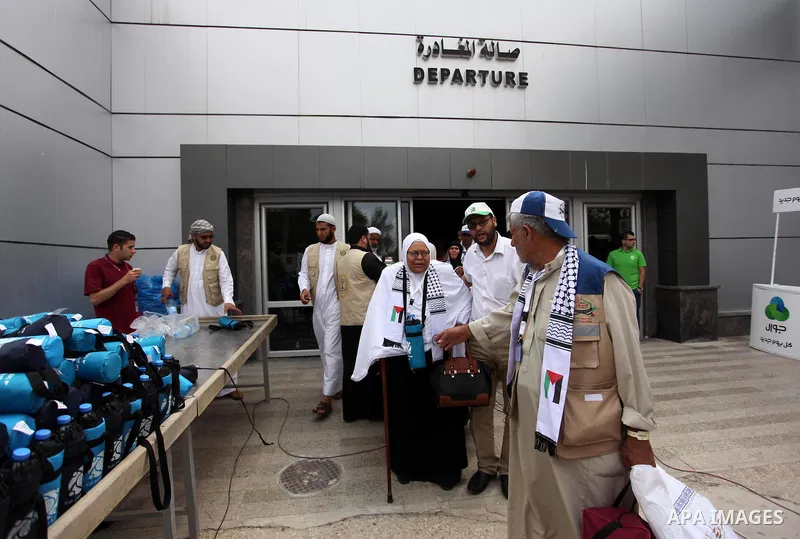Palestinian Muslim pilgrims arrive at the Rafah border crossing between Egypt and the southern Gaza Strip, on August 30, 2016 ahead of their departure to the annual Hajj pilgrimage in Saudi Arabia's holy city of Mecca. P...