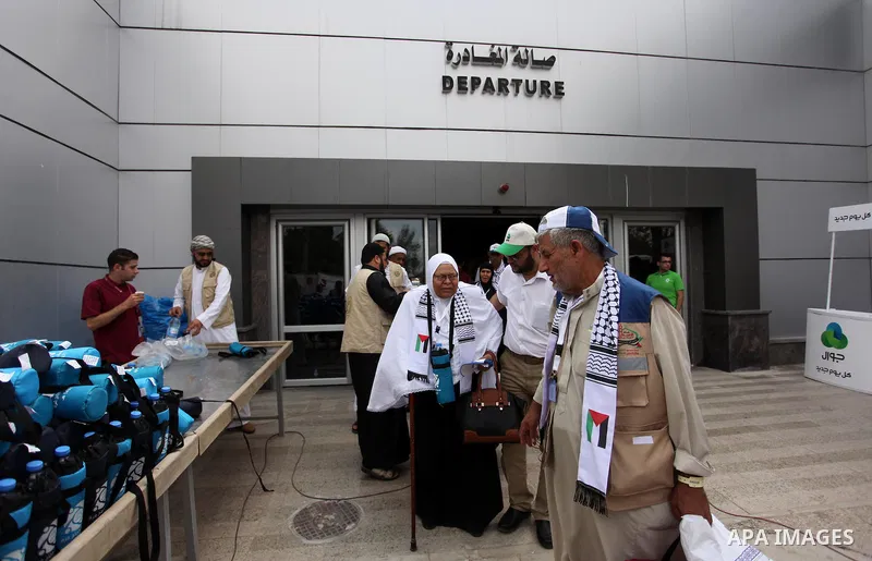 Palestinian Muslim pilgrims arrive at the Rafah border crossing between Egypt and the southern Gaza Strip, on August 30, 2016 ahead of their departure to the annual Hajj pilgrimage in Saudi Arabia's holy city of Mecca. P...