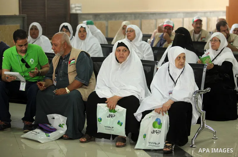 Palestinian Muslim pilgrims wait at the Rafah border crossing between Egypt and the southern Gaza Strip, on August 30, 2016 ahead of their departure to the annual Hajj pilgrimage in Saudi Arabia's holy city of Mecca. Pho...