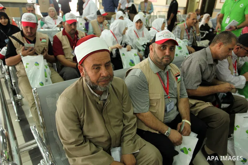Palestinian Muslim pilgrims wait at the Rafah border crossing between Egypt and the southern Gaza Strip, on August 30, 2016 ahead of their departure to the annual Hajj pilgrimage in Saudi Arabia's holy city of Mecca. Pho...