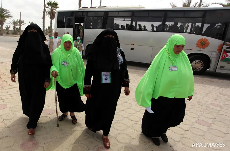 Palestinian Muslim pilgrims arrive at the Rafah border crossing between Egypt and the southern Gaza Strip, on August 30, 2016 ahead of their departure to the annual Hajj pilgrimage in Saudi Arabia's holy city of Mecca. P...