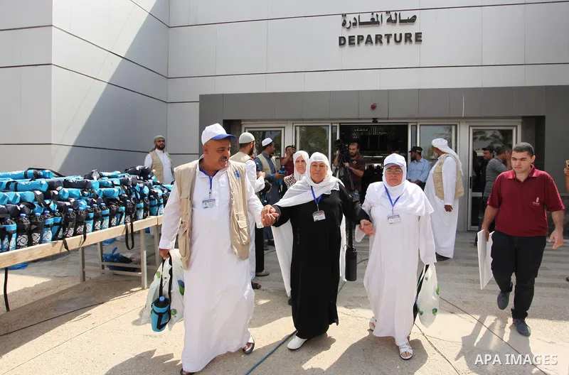 Palestinian Muslim pilgrims arrive at the Rafah border crossing between Egypt and the southern Gaza Strip, on August 30, 2016 ahead of their departure to the annual Hajj pilgrimage in Saudi Arabia's holy city of Mecca. P...
