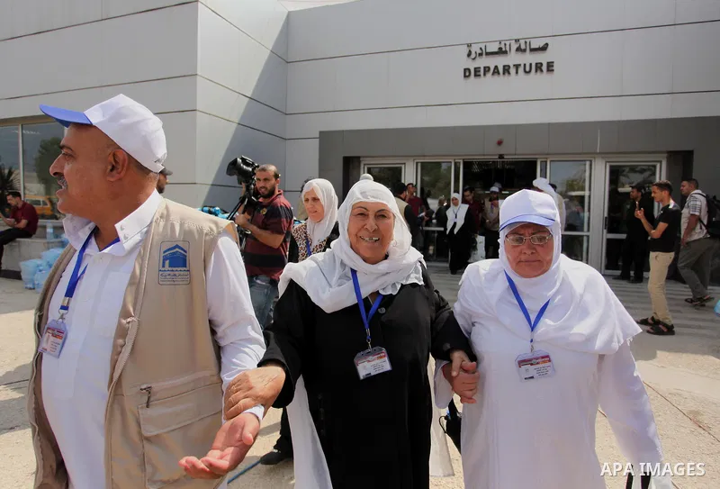 Palestinian Muslim pilgrims arrive at the Rafah border crossing between Egypt and the southern Gaza Strip, on August 30, 2016 ahead of their departure to the annual Hajj pilgrimage in Saudi Arabia's holy city of Mecca. P...