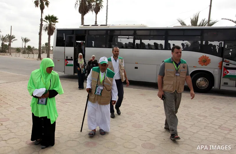 Palestinian Muslim pilgrims arrive at the Rafah border crossing between Egypt and the southern Gaza Strip, on August 30, 2016 ahead of their departure to the annual Hajj pilgrimage in Saudi Arabia's holy city of Mecca. P...