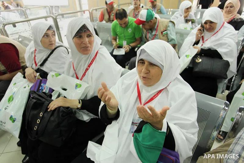 Palestinian Muslim pilgrims wait at the Rafah border crossing between Egypt and the southern Gaza Strip, on August 30, 2016 ahead of their departure to the annual Hajj pilgrimage in Saudi Arabia's holy city of Mecca. Pho...