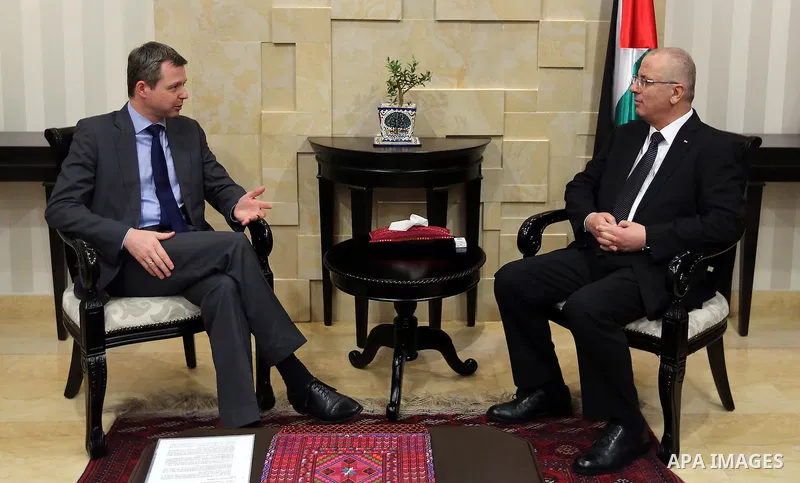 Palestinian Prime Minister Rami Hamdallah meets with Parliamentary State Secretary to the Federal Minister for Economic Cooperation and Development German, Thomas Silberhorn in the West Bank city of Ramallah, on Aug. 30,...