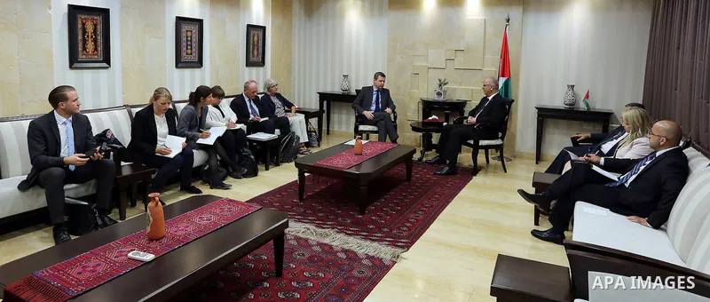 Palestinian Prime Minister Rami Hamdallah meets with Parliamentary State Secretary to the Federal Minister for Economic Cooperation and Development German, Thomas Silberhorn in the West Bank city of Ramallah, on Aug. 30,...