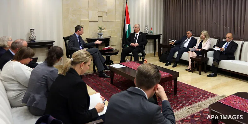 Palestinian Prime Minister Rami Hamdallah meets with Parliamentary State Secretary to the Federal Minister for Economic Cooperation and Development German, Thomas Silberhorn in the West Bank city of Ramallah, on Aug. 30,...