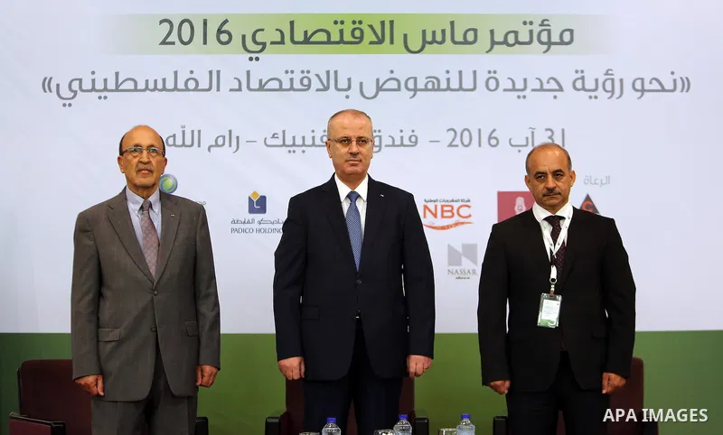 Palestinian Prime Minister, Rami Hamadallah, attends Economic MAS conference 2016, in the West Bank city of Ramallah, on Aug 31, 2016. Photo by Prime Minister Office