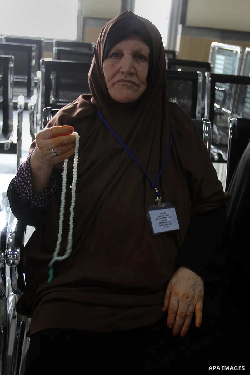 Palestinian Muslim pilgrims wait at the Rafah border crossing between Egypt and the southern Gaza Strip, on August 31, 2016 ahead of their departure to the annual Hajj pilgrimage in Saudi Arabia's holy city of Mecca. Pho...