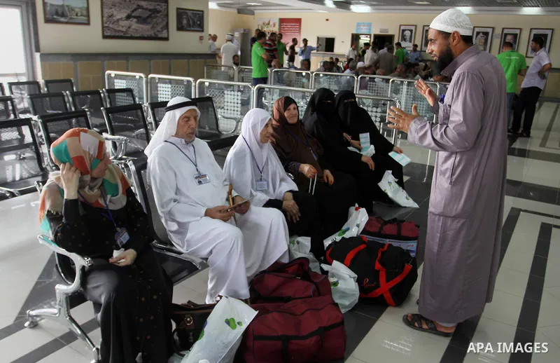 Palestinian Muslim pilgrims wait at the Rafah border crossing between Egypt and the southern Gaza Strip, on August 31, 2016 ahead of their departure to the annual Hajj pilgrimage in Saudi Arabia's holy city of Mecca. Pho...