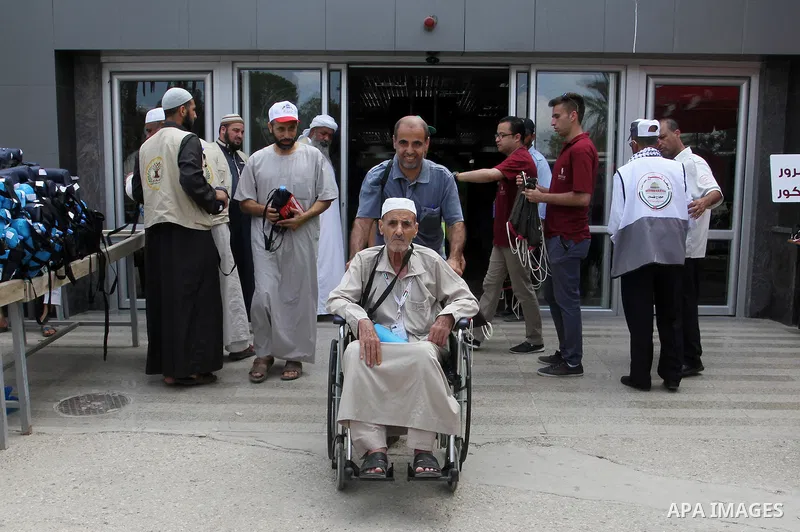 Palestinian Muslim pilgrims arrive at the Rafah border crossing between Egypt and the southern Gaza Strip, on August 31, 2016 ahead of their departure to the annual Hajj pilgrimage in Saudi Arabia's holy city of Mecca. P...