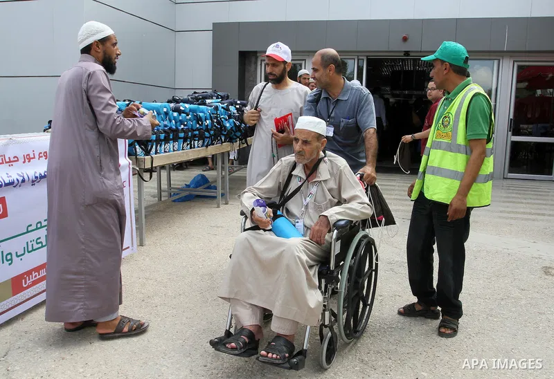 Palestinian Muslim pilgrims arrive at the Rafah border crossing between Egypt and the southern Gaza Strip, on August 31, 2016 ahead of their departure to the annual Hajj pilgrimage in Saudi Arabia's holy city of Mecca. P...