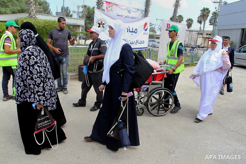 Palestinian Muslim pilgrims arrive at the Rafah border crossing between Egypt and the southern Gaza Strip, on August 31, 2016 ahead of their departure to the annual Hajj pilgrimage in Saudi Arabia's holy city of Mecca. P...