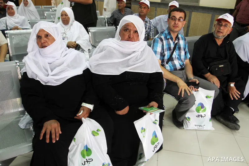 Palestinian Muslim pilgrims wait at the Rafah border crossing between Egypt and the southern Gaza Strip, on August 31, 2016 ahead of their departure to the annual Hajj pilgrimage in Saudi Arabia's holy city of Mecca. Pho...