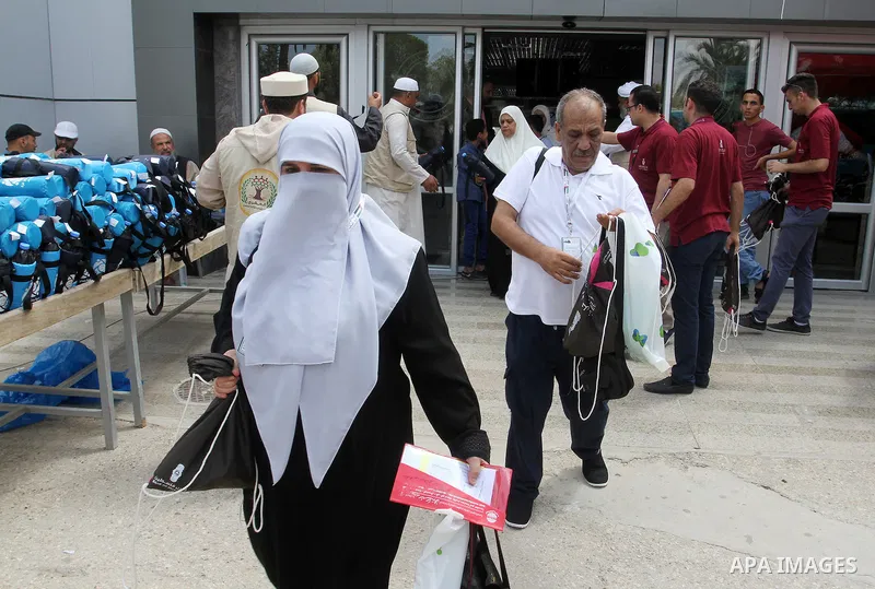 Palestinian Muslim pilgrims arrive at the Rafah border crossing between Egypt and the southern Gaza Strip, on August 31, 2016 ahead of their departure to the annual Hajj pilgrimage in Saudi Arabia's holy city of Mecca. P...