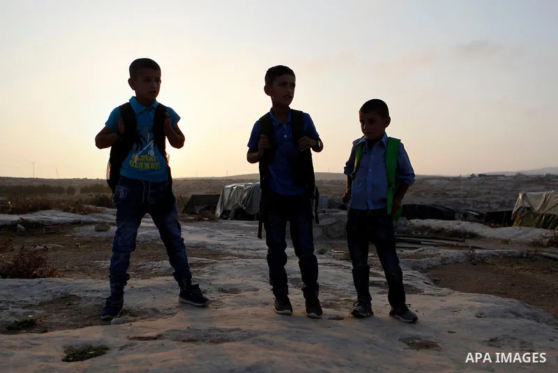 Palestinian school students go to school in the West Bank village of Sosiya, south of Hebron, on September 1 2016, villages in Yatta area south of Hebron suffer from lack of schools and transportations and students have...