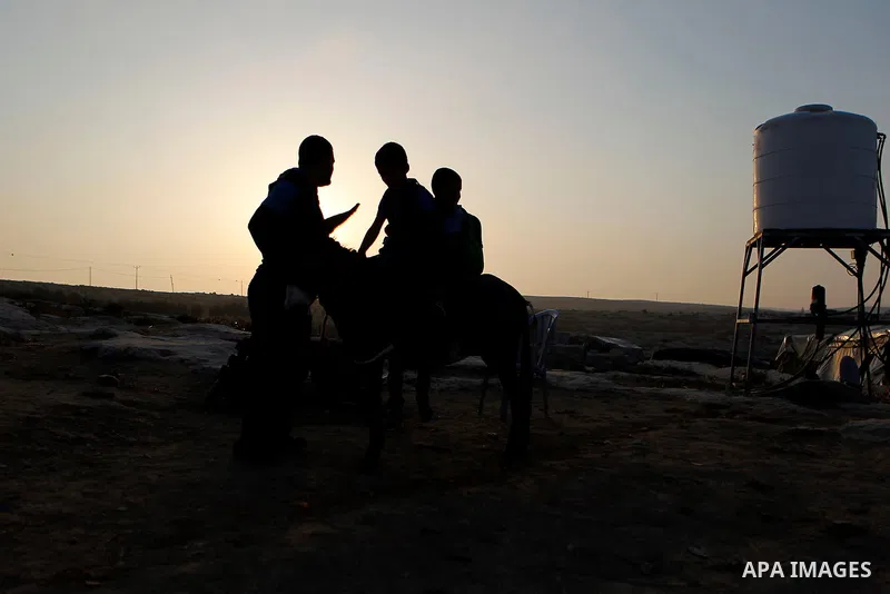 Palestinian school students go to school in the West Bank village of Sosiya, south of Hebron, on September 1 2016, villages in Yatta area south of Hebron suffer from lack of schools and transportations and students have...