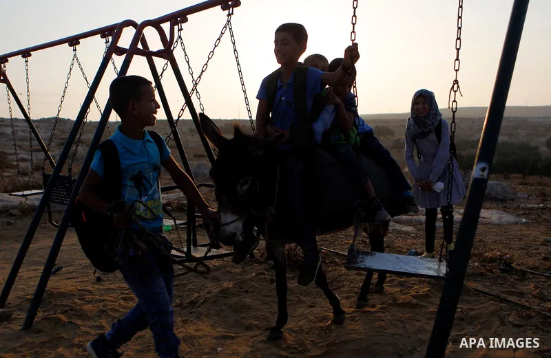 Palestinian school students play before going to school in the West Bank village of Sosiya, south of Hebron, on September 1 2016, villages in Yatta area south of Hebron suffer from lack of schools and transportations and...
