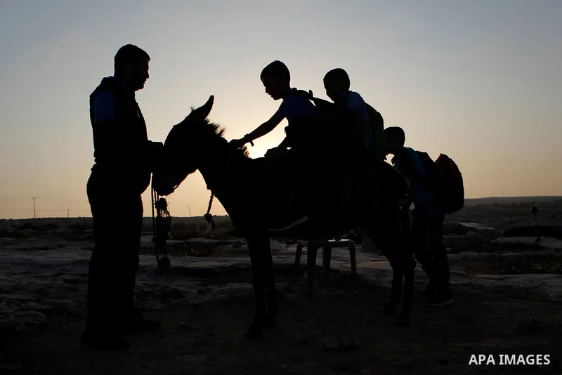 Palestinian school students go to school in the West Bank village of Sosiya, south of Hebron, on September 1 2016, villages in Yatta area south of Hebron suffer from lack of schools and transportations and students have...