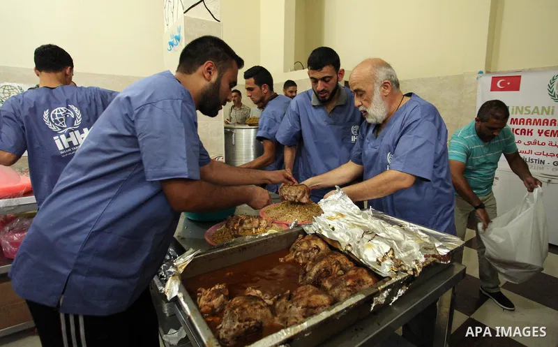 Chairman of Turkish humanitarian relief (IHH), Mohammed Kaya, attends the opening ceremony of a kitchen martyrs of the Freedom Flotilla (Mavi Marmara), which provides free meals for poor families, in Gaza city, on Sept....
