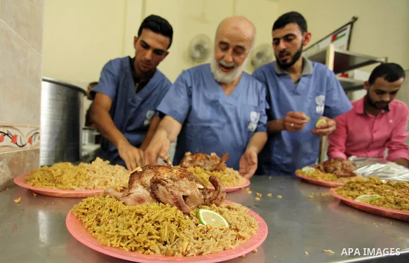 Chairman of Turkish humanitarian relief (IHH), Mohammed Kaya, attends the opening ceremony of a kitchen martyrs of the Freedom Flotilla (Mavi Marmara), which provides free meals for poor families, in Gaza city, on Sept....