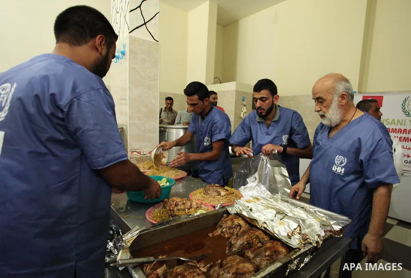 Chairman of Turkish humanitarian relief (IHH), Mohammed Kaya, attends the opening ceremony of a kitchen martyrs of the Freedom Flotilla (Mavi Marmara), which provides free meals for poor families, in Gaza city, on Sept....