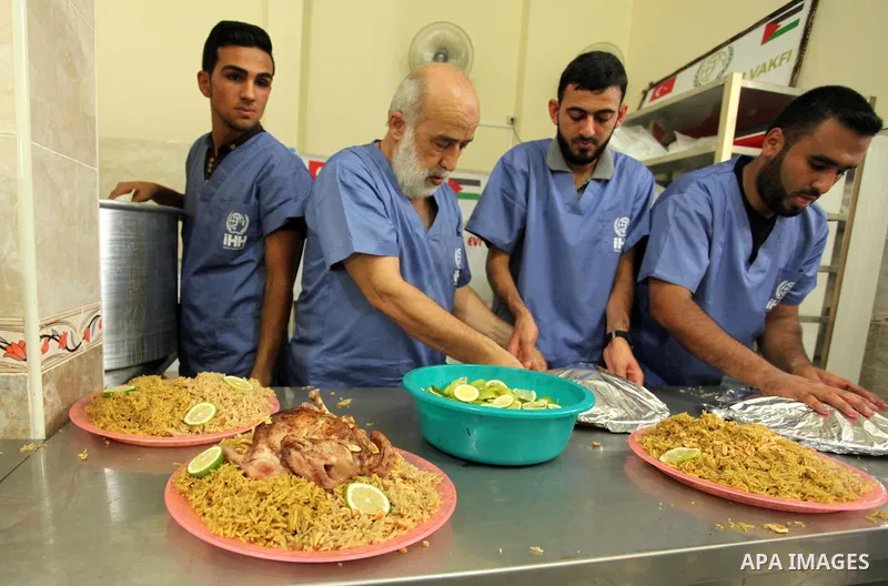 Chairman of Turkish humanitarian relief (IHH), Mohammed Kaya, attends the opening ceremony of a kitchen martyrs of the Freedom Flotilla (Mavi Marmara), which provides free meals for poor families, in Gaza city, on Sept....