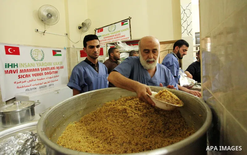 Chairman of Turkish humanitarian relief (IHH), Mohammed Kaya, attends the opening ceremony of a kitchen martyrs of the Freedom Flotilla (Mavi Marmara), which provides free meals for poor families, in Gaza city, on Sept....