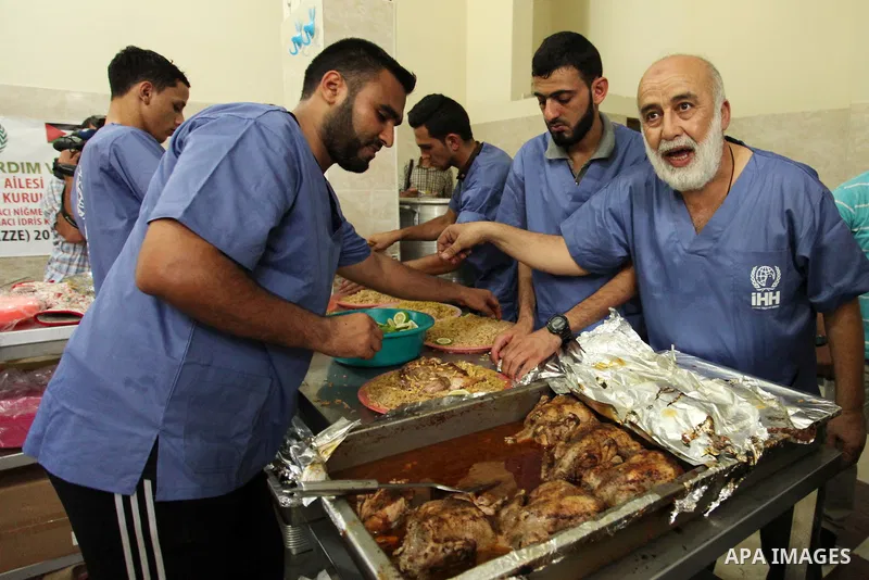 Chairman of Turkish humanitarian relief (IHH), Mohammed Kaya, attends the opening ceremony of a kitchen martyrs of the Freedom Flotilla (Mavi Marmara), which provides free meals for poor families, in Gaza city, on Sept....