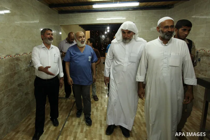 Chairman of Turkish humanitarian relief (IHH), Mohammed Kaya, attends the opening ceremony of a kitchen martyrs of the Freedom Flotilla (Mavi Marmara), which provides free meals for poor families, in Gaza city, on Sept....