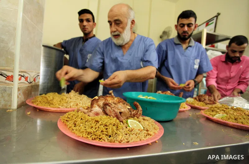 Chairman of Turkish humanitarian relief (IHH), Mohammed Kaya, attends the opening ceremony of a kitchen martyrs of the Freedom Flotilla (Mavi Marmara), which provides free meals for poor families, in Gaza city, on Sept....