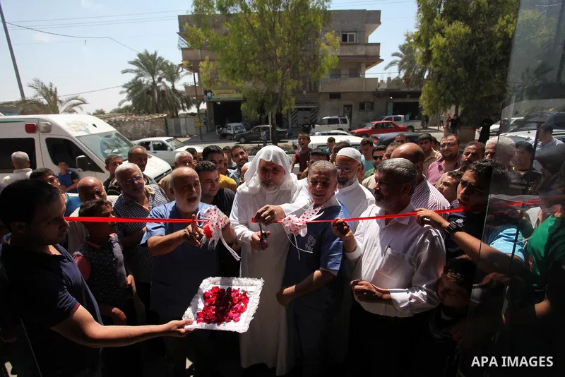 Chairman of Turkish humanitarian relief (IHH), Mohammed Kaya, attends the opening ceremony of a kitchen martyrs of the Freedom Flotilla (Mavi Marmara), which provides free meals for poor families, in Gaza city, on Sept....