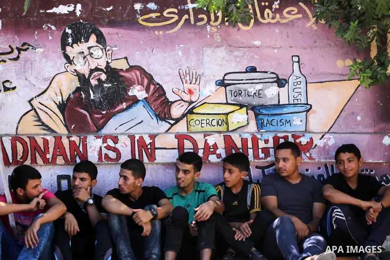 Palestinian supporters of the Islamic Jihad Movement attend Friday prayers to show solidarity with Palestinian prisoners in Israeli Jails, in front of Red cross office in Gaza city, on Sep. 02, 2016. Photo by Mohammed As...
